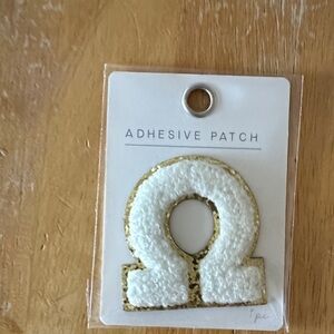 Omega—Gold and White Adhesive Patch